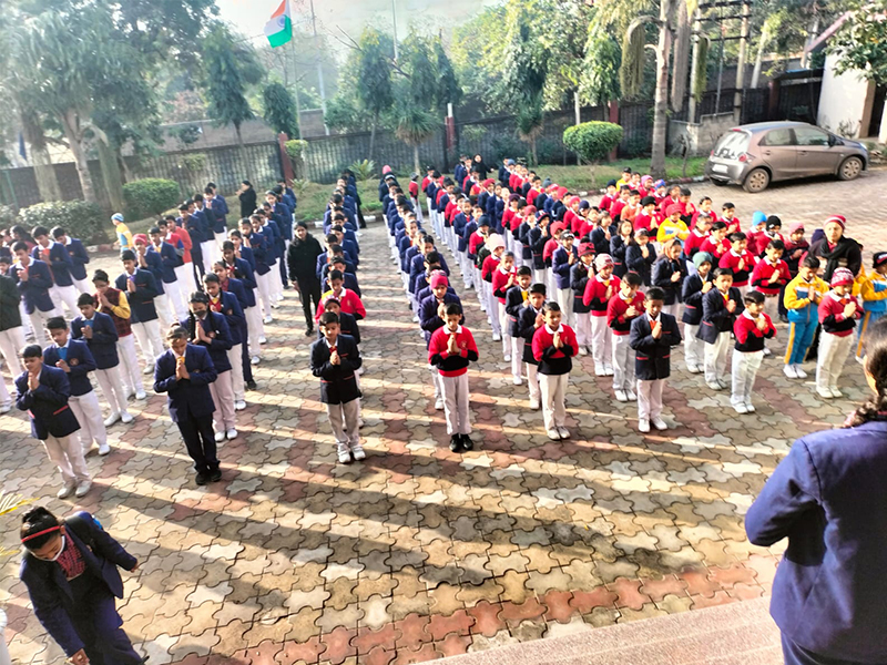 Morning Assembly at SDIS Faridabad A group of students in a school assembly
